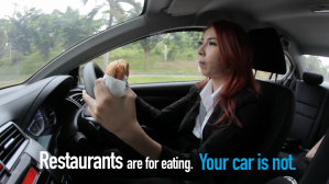 Woman driving with a donut